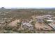 Expansive aerial view showcasing a rural property with multiple structures and desert landscaping at 49011 N 7Th Ave, New River, AZ 85087