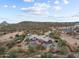 Aerial view showcasing the home, desert landscape, and outdoor spaces at 49011 N 7Th Ave, New River, AZ 85087