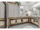 Bright bathroom featuring double sinks, ample storage, and neutral tones, providing a functional and elegant space at 49011 N 7Th Ave, New River, AZ 85087