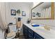 Well-lit bathroom featuring double sinks, elegant fixtures, and tasteful decorative accents at 49011 N 7Th Ave, New River, AZ 85087