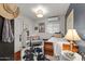 Charming bedroom with vintage-inspired furniture, soft lighting, and unique decor, creating a warm atmosphere at 49011 N 7Th Ave, New River, AZ 85087