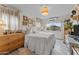 Bright bedroom featuring soft, natural light, a plush bed, and eclectic art, evoking comfort and relaxation at 49011 N 7Th Ave, New River, AZ 85087