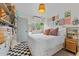 Comfortable bedroom with a cozy bed, natural light, and a personal touch through art and decor at 49011 N 7Th Ave, New River, AZ 85087