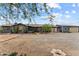 Charming single-story home with a desert landscape, gravel yard, and a welcoming entrance at 49011 N 7Th Ave, New River, AZ 85087