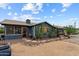 Charming single-story home with a well-maintained yard, desert landscaping, and inviting front entrance at 49011 N 7Th Ave, New River, AZ 85087