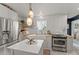 Bright, stylish kitchen with stainless steel appliances, farmhouse sink, and butcher block countertops at 49011 N 7Th Ave, New River, AZ 85087