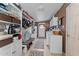 Efficient laundry room equipped with ample storage, shelving, and functional layout at 49011 N 7Th Ave, New River, AZ 85087