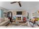 Cozy living room featuring a fireplace, plush seating, and stylish decor at 49011 N 7Th Ave, New River, AZ 85087