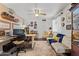 Bright home office with ample natural light, functional layout, and comfortable seating at 49011 N 7Th Ave, New River, AZ 85087