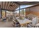 Bright sunroom featuring a dining area, comfortable seating, and scenic outdoor views at 49011 N 7Th Ave, New River, AZ 85087