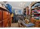 Spacious walk-in closet with custom shelving and ample storage for organized wardrobe solutions at 49011 N 7Th Ave, New River, AZ 85087