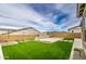 Picture of a backyard with artificial turf and a built in fire feature, mountain backdrop at 5650 E Scarlet St, Mesa, AZ 85215