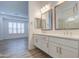 Spacious bathroom with double sinks, ample counter space, and a view of the bedroom at 5650 E Scarlet St, Mesa, AZ 85215