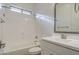 Bright bathroom featuring a tub and shower combination with modern fixtures and white finishes at 5650 E Scarlet St, Mesa, AZ 85215