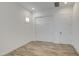 Bedroom includes wood-look tile floors, white walls, and a closet at 5650 E Scarlet St, Mesa, AZ 85215