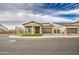 Charming home on a corner lot showcasing a well-maintained lawn and neutral-toned facade at 5650 E Scarlet St, Mesa, AZ 85215