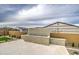 An outdoor fire feature with an attractive concrete base, landscaping, and patio at 5650 E Scarlet St, Mesa, AZ 85215