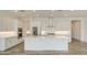 Spacious kitchen featuring white cabinets, stainless steel appliances, and a large island at 5650 E Scarlet St, Mesa, AZ 85215