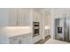 Modern kitchen showcasing white cabinetry, stainless steel appliances, and sleek countertops at 5650 E Scarlet St, Mesa, AZ 85215