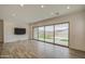 Bright living room offers views of the backyard through a large sliding glass door at 5650 E Scarlet St, Mesa, AZ 85215
