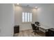 Office with a large desk, office chair, and a window dressed with shutters at 5650 E Scarlet St, Mesa, AZ 85215