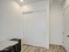 Office area with a large closet space and white doors at 5650 E Scarlet St, Mesa, AZ 85215