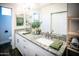 Bathroom with granite countertop, dual sinks, and modern fixtures at 7531 E Billings St # 132, Mesa, AZ 85207