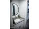 Modern bathroom features a vanity with a granite countertop, white cabinets, and stainless steel fixtures at 7531 E Billings St # 132, Mesa, AZ 85207