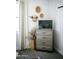 Neutral bedroom featuring a dresser with TV and decorated with natural-toned decor at 7531 E Billings St # 132, Mesa, AZ 85207