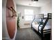 Stylish bedroom features a bunk bed, modern wall accents, and soft lighting, offering a comfortable and inviting space at 7531 E Billings St # 132, Mesa, AZ 85207