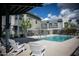 Inviting community pool with lounge chairs, clear blue water, and shade trellis at 7531 E Billings St # 132, Mesa, AZ 85207