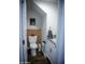 Compact half bathroom boasts a modern vanity, toilet, and stylish design, creating a functional and appealing space at 7531 E Billings St # 132, Mesa, AZ 85207