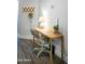 Functional home office space with wooden desk, comfortable chair, and stylish decor at 7531 E Billings St # 132, Mesa, AZ 85207