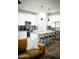 Bright, modern kitchen with stainless steel appliances, granite countertops, and stylish barstool seating at 7531 E Billings St # 132, Mesa, AZ 85207