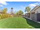 Expansive backyard with lush green grass, mature landscaping, and privacy fencing at 804 E Palmaire Ave, Phoenix, AZ 85020