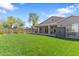 Large backyard with well-maintained lawn, covered patio, and neutral color stucco exterior at 804 E Palmaire Ave, Phoenix, AZ 85020
