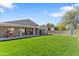 Spacious backyard featuring lush lawn, a covered patio, and storage shed, perfect for outdoor enjoyment at 804 E Palmaire Ave, Phoenix, AZ 85020