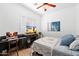 Comfortable bedroom features a desk, a cozy bed, and a charming window with lots of light at 804 E Palmaire Ave, Phoenix, AZ 85020