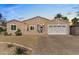 Well-lit single-story home boasting a brick driveway, two-car garage, and inviting curb appeal at 804 E Palmaire Ave, Phoenix, AZ 85020