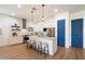Bright, modern kitchen with white cabinets, stainless steel appliances, and a stylish island at 804 E Palmaire Ave, Phoenix, AZ 85020