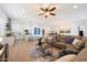 Open-concept living area with a modern kitchen, comfortable seating, and lots of natural light at 804 E Palmaire Ave, Phoenix, AZ 85020