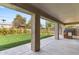 Covered patio offering a view of the well-manicured backyard with lush greenery and ample space at 804 E Palmaire Ave, Phoenix, AZ 85020