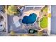 Aerial view of a spacious backyard featuring a freeform pool, putting green, and seating areas at 8219 E Tesoro Cir, Mesa, AZ 85207