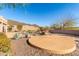 Spacious backyard with a pool, desert landscaping, and rock accents, perfect for outdoor entertaining at 8219 E Tesoro Cir, Mesa, AZ 85207