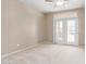 Bedroom with neutral carpet and access to an outdoor patio at 8219 E Tesoro Cir, Mesa, AZ 85207
