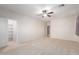 Spacious bedroom features neutral carpet, ceiling fan and closet at 8219 E Tesoro Cir, Mesa, AZ 85207
