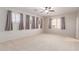 Bedroom featuring carpet, ceiling fan and large windows at 8219 E Tesoro Cir, Mesa, AZ 85207