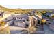 Desert home featuring an attached three car garage, desert landscaping, and views at 8219 E Tesoro Cir, Mesa, AZ 85207