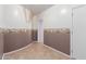 Hallway with stylish wall decor with a film-inspired theme and tiled floors at 8219 E Tesoro Cir, Mesa, AZ 85207