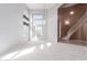 Spacious living room with staircase access at 8219 E Tesoro Cir, Mesa, AZ 85207